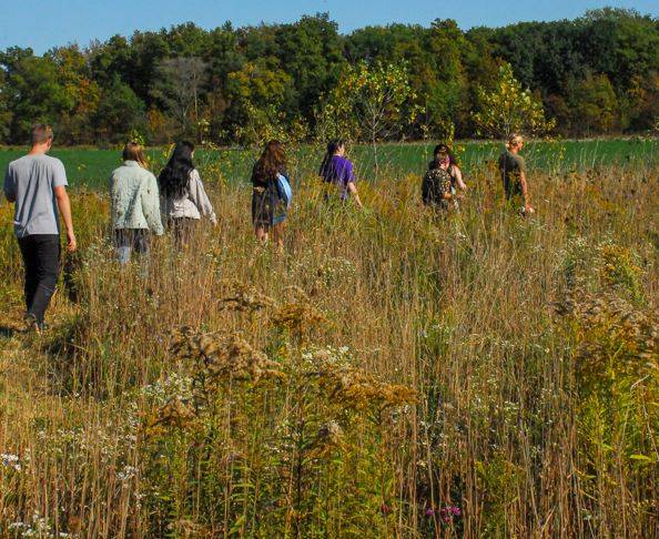 SAP visitors enjoy a tour through the native prairie.